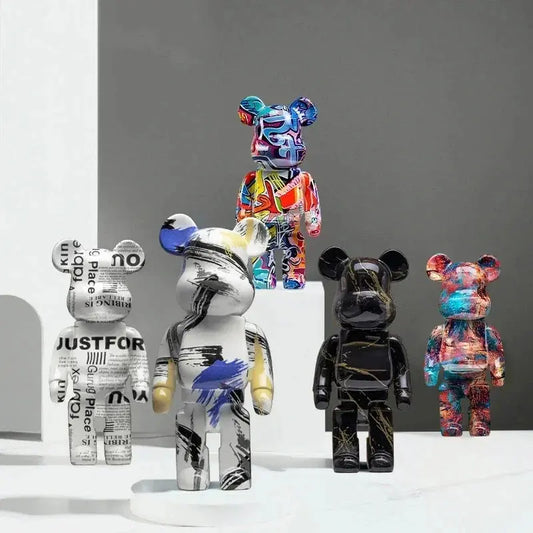 Five colorful bear figurines with various designs on a gray background be@rbrick collectable