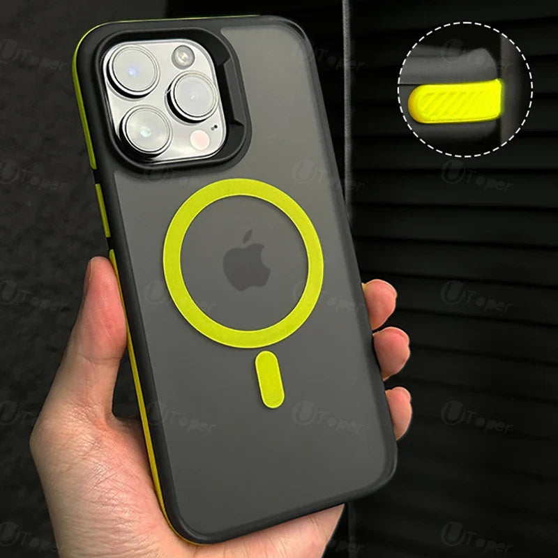 Phone case with Apple logo and yellow accents held by a hand against a dark background