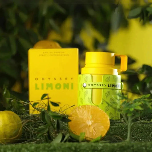 Odyssey Limoni perfume bottle and packaging with lemons and greenery in the background