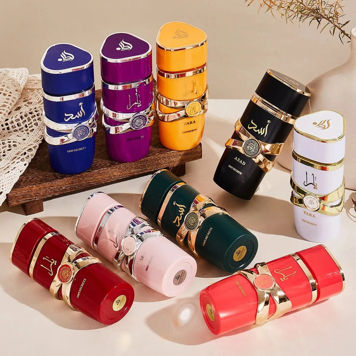 Colorful lip balm containers with gold accents on a light surface.