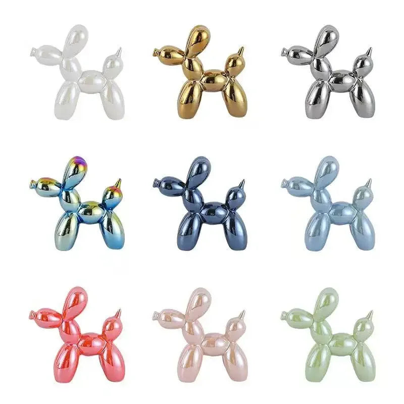 Collection of metallic balloon dog figurines in various colors on a white background
