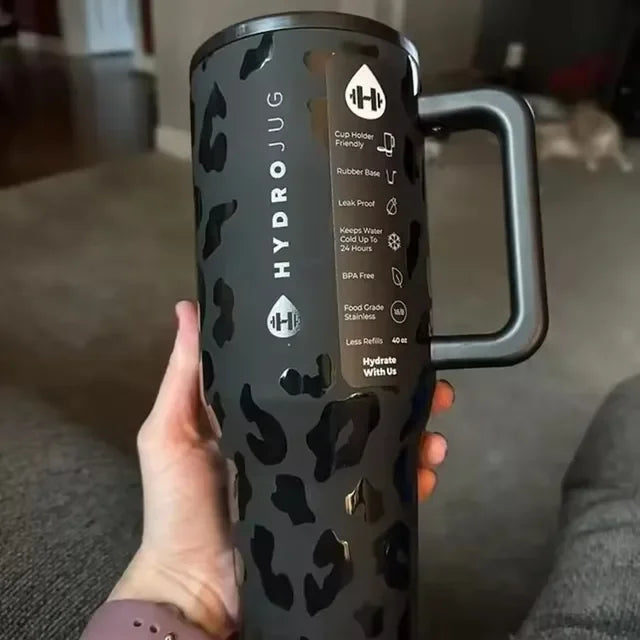 Close-up of black leopard print HydroJug Gobelet 40OZ Voyageur Thermos with product features listed on the side label.