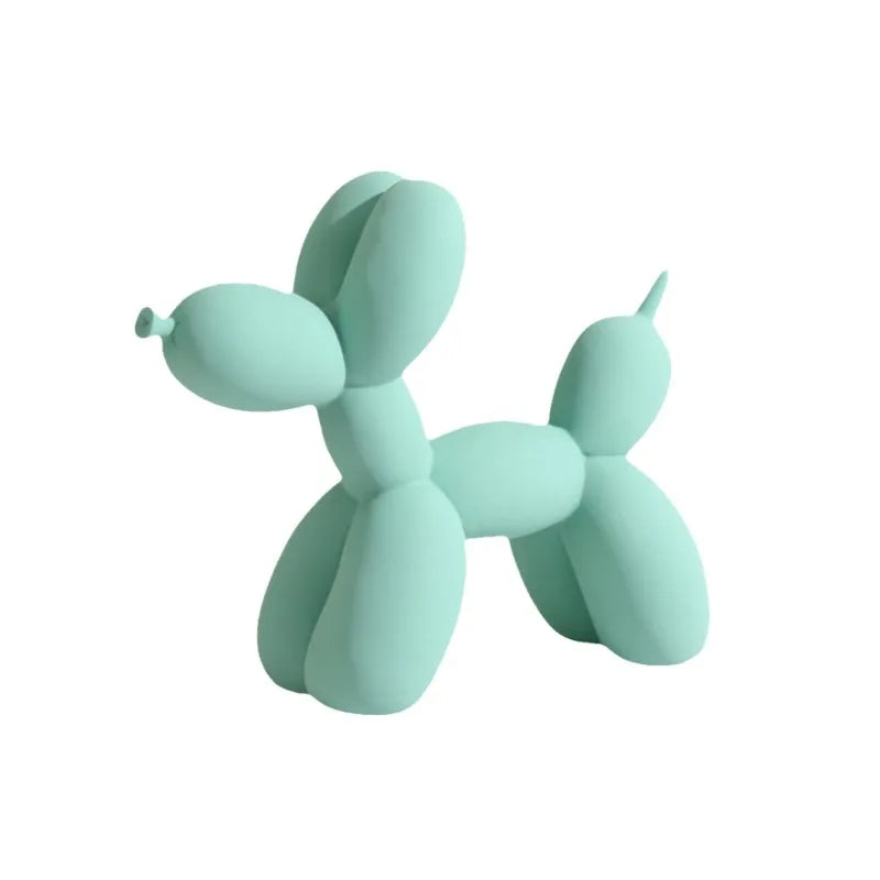 Mint green balloon dog sculpture on a white background