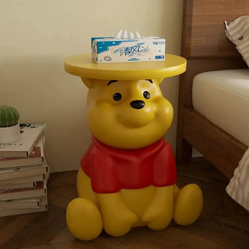Whinnie the Pooh kids Yellow bear-shaped side table with a box of tissues on top, in a room setting.