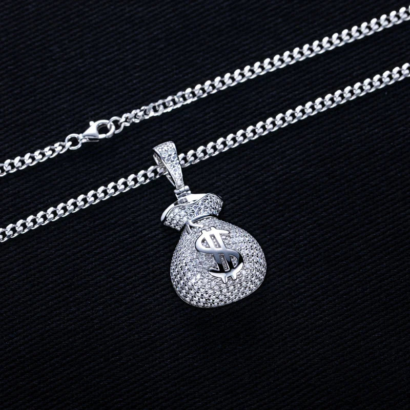 Silver necklace with a dollar bag pendant on a black background