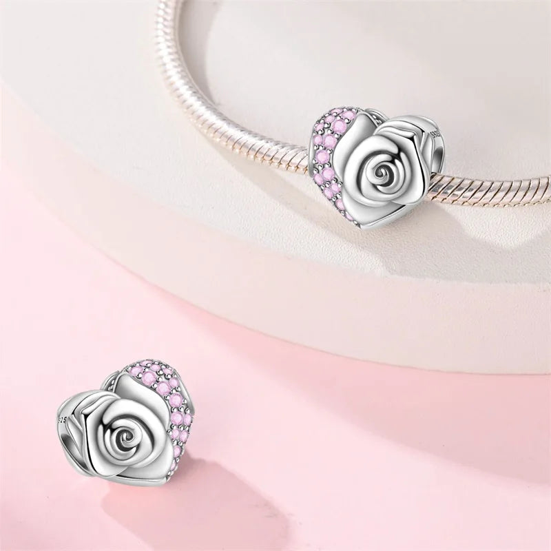 Heart-shaped rose charm on a pink and white gradient background. pandora style