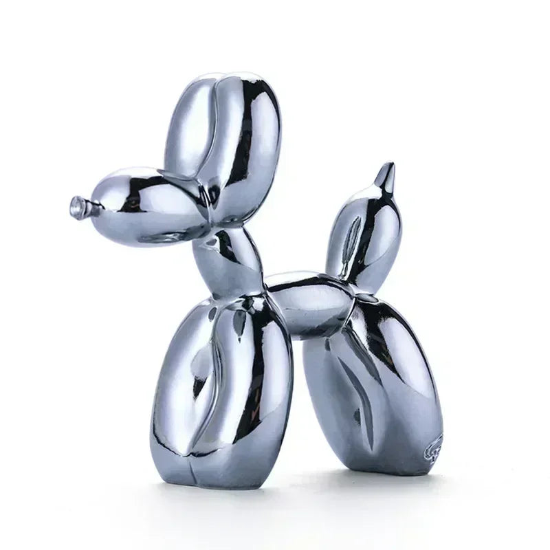 Chromed balloon dog sculpture on a white background