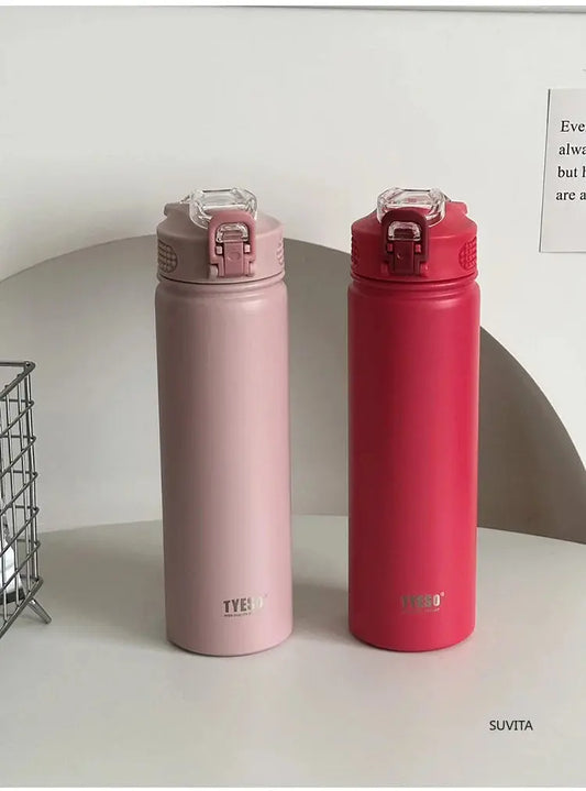 TYESO thermos water bottles in pink and red with flip-top straw lids. BPA-free and ideal for daily hydration on the go.