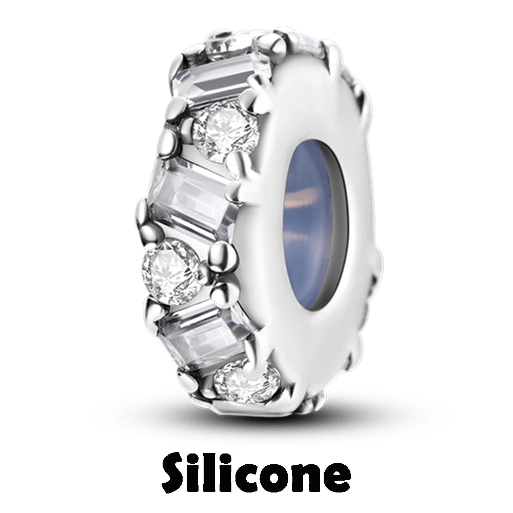 Silver ring with gemstones on a white background, labeled 'Silicone'.