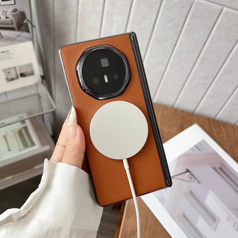 Phone case with a white circular design held by a hand, with a blurred indoor background.