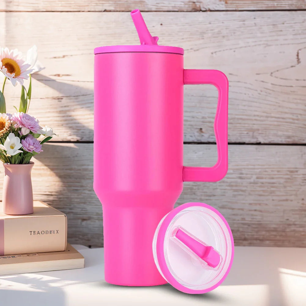 Bright pink 40 oz tumbler with flip straw lid and extra lid shown, reusable and spill proof replacement for Stanley Quencher