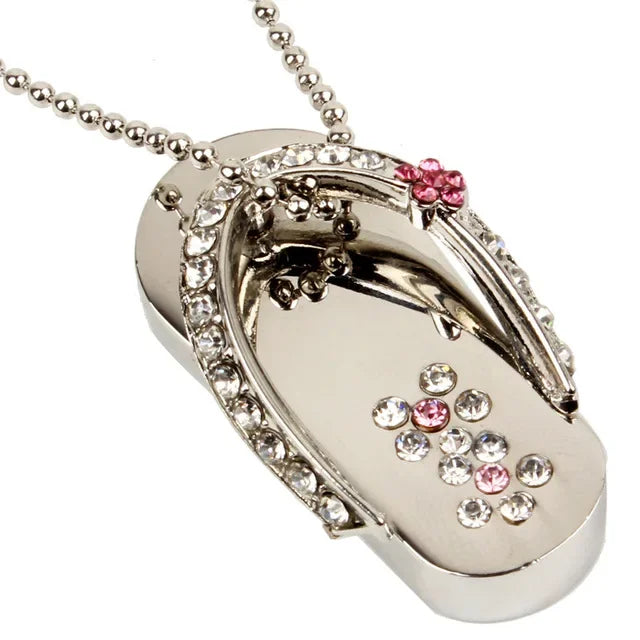 Silver flip-flop pendant with gemstones on a white background