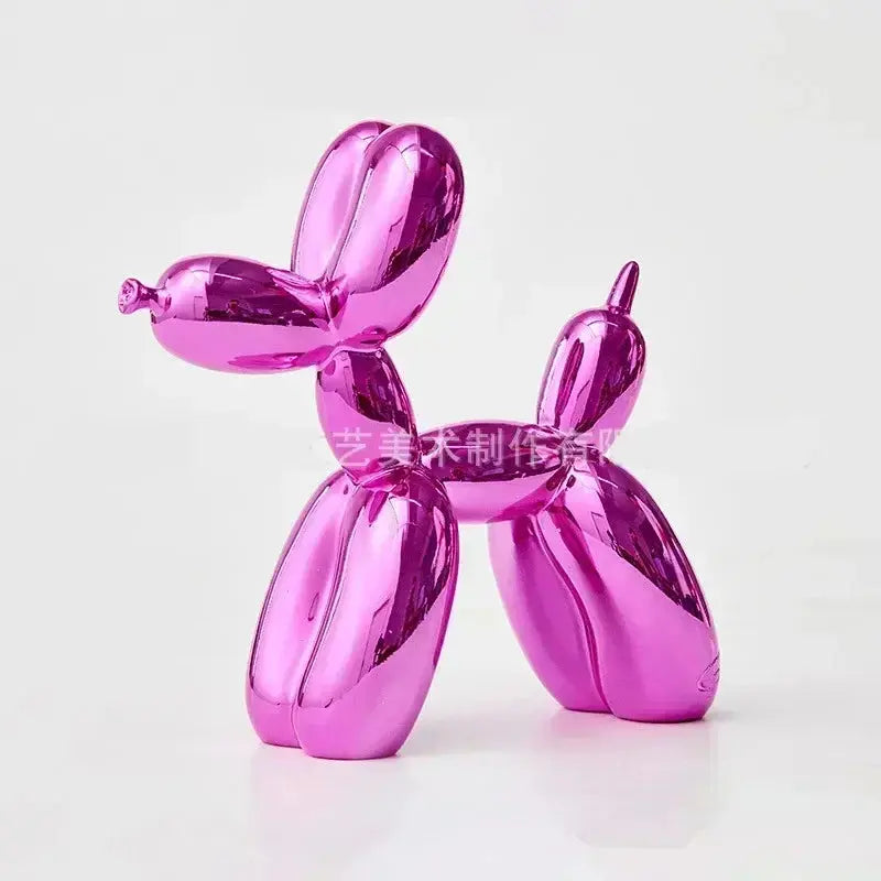 Shiny pink balloon dog sculpture on a white background