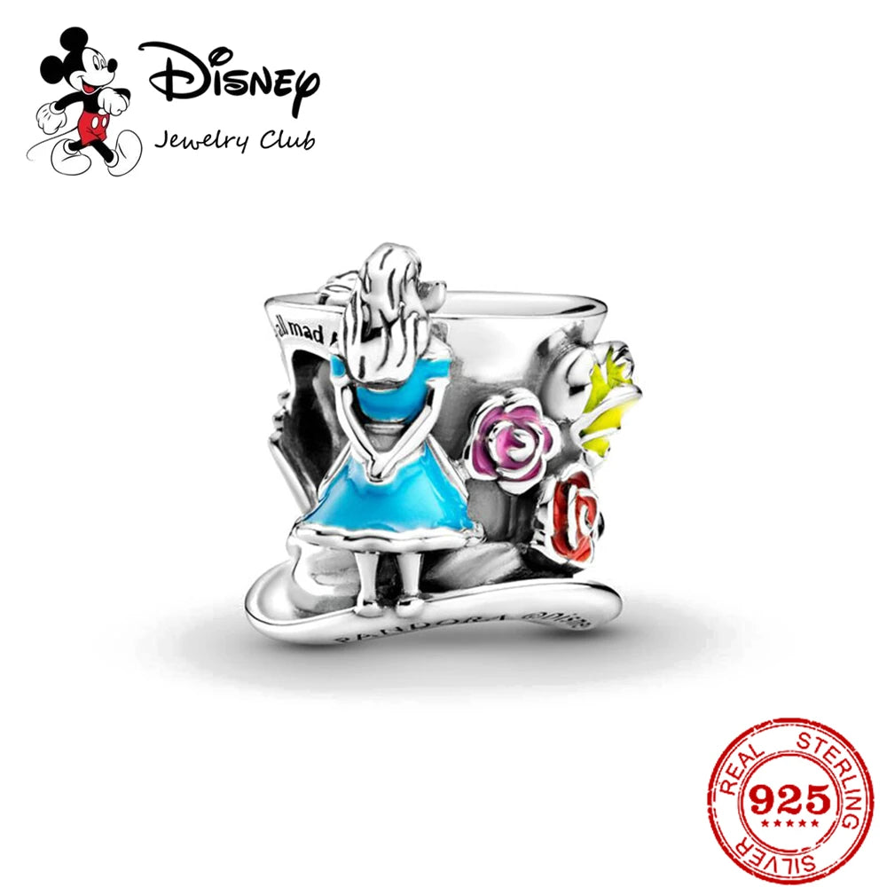 Disney jewelry charm featuring a character in a blue dress with flowers on a white background.