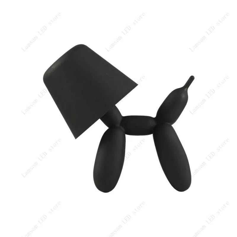 Black balloon dog sculpture on a white background