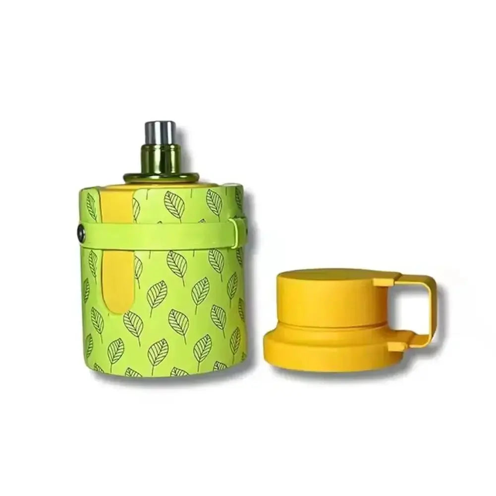 Green and yellow container with a leaf pattern and a matching yellow lid on a white background