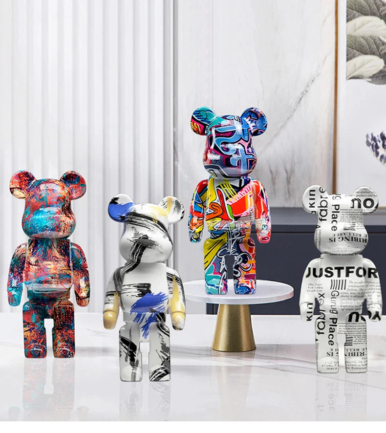 Four colorful and patterned bears on a white surface with a minimal background be@rbrick collectable