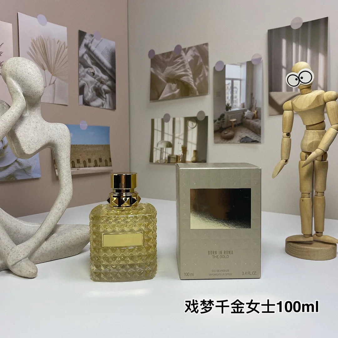 Valentino Perfume bottle and box with decorative items on a table