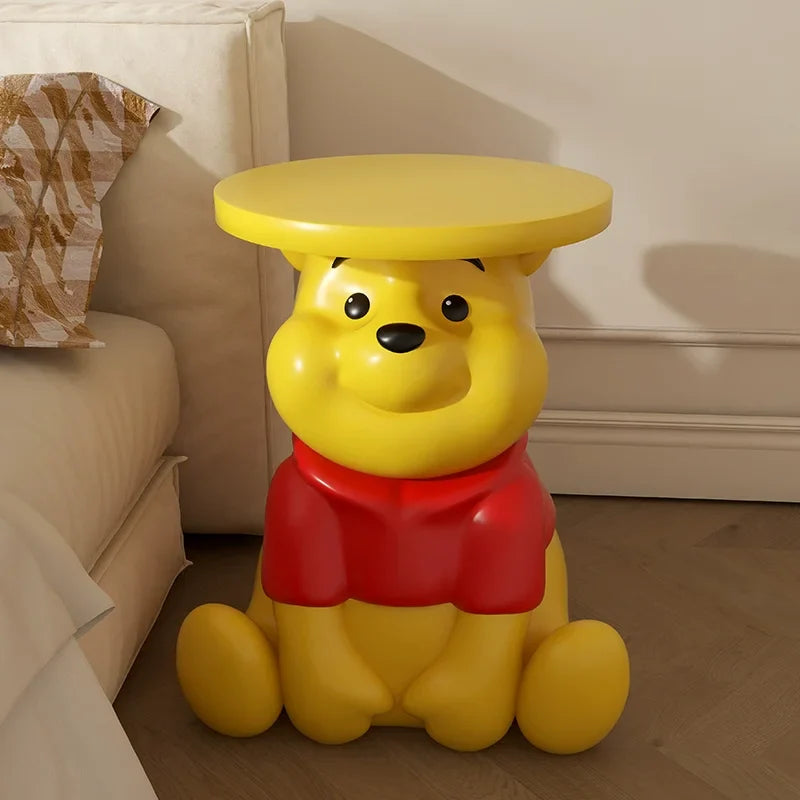Whinnie the Pooh kids Yellow bear-shaped side table in a living room setting