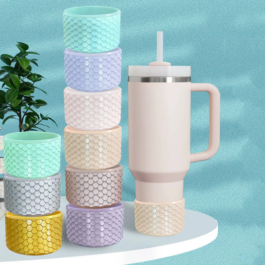 Stanley Mermaid silicone boot for 40oz Quencher cups in various colors on a white background.