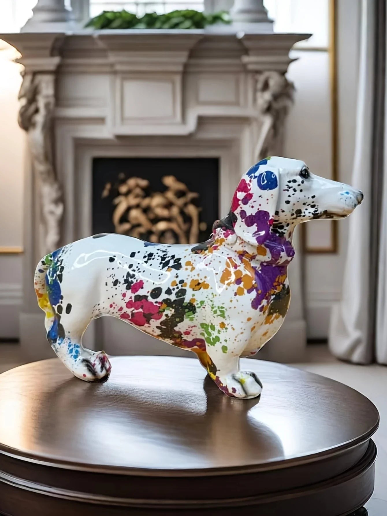 Colorful ceramic dog sculpture on a wooden table with a fireplace in the background dashhound