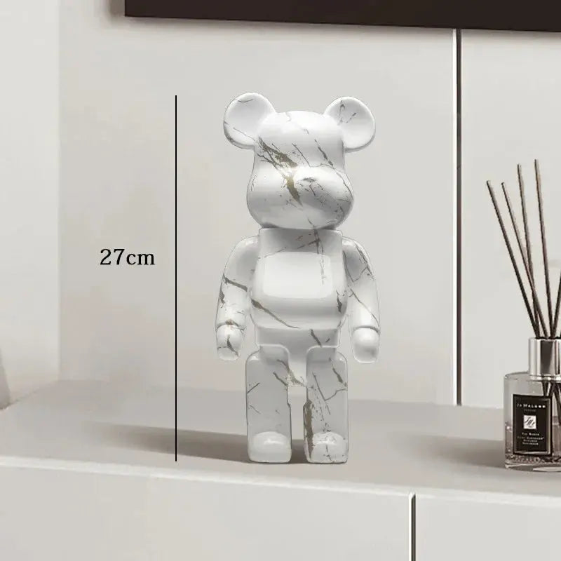 Marble-patterned bear figure on a white surface with a diffuser in the background be@rbrick collectable