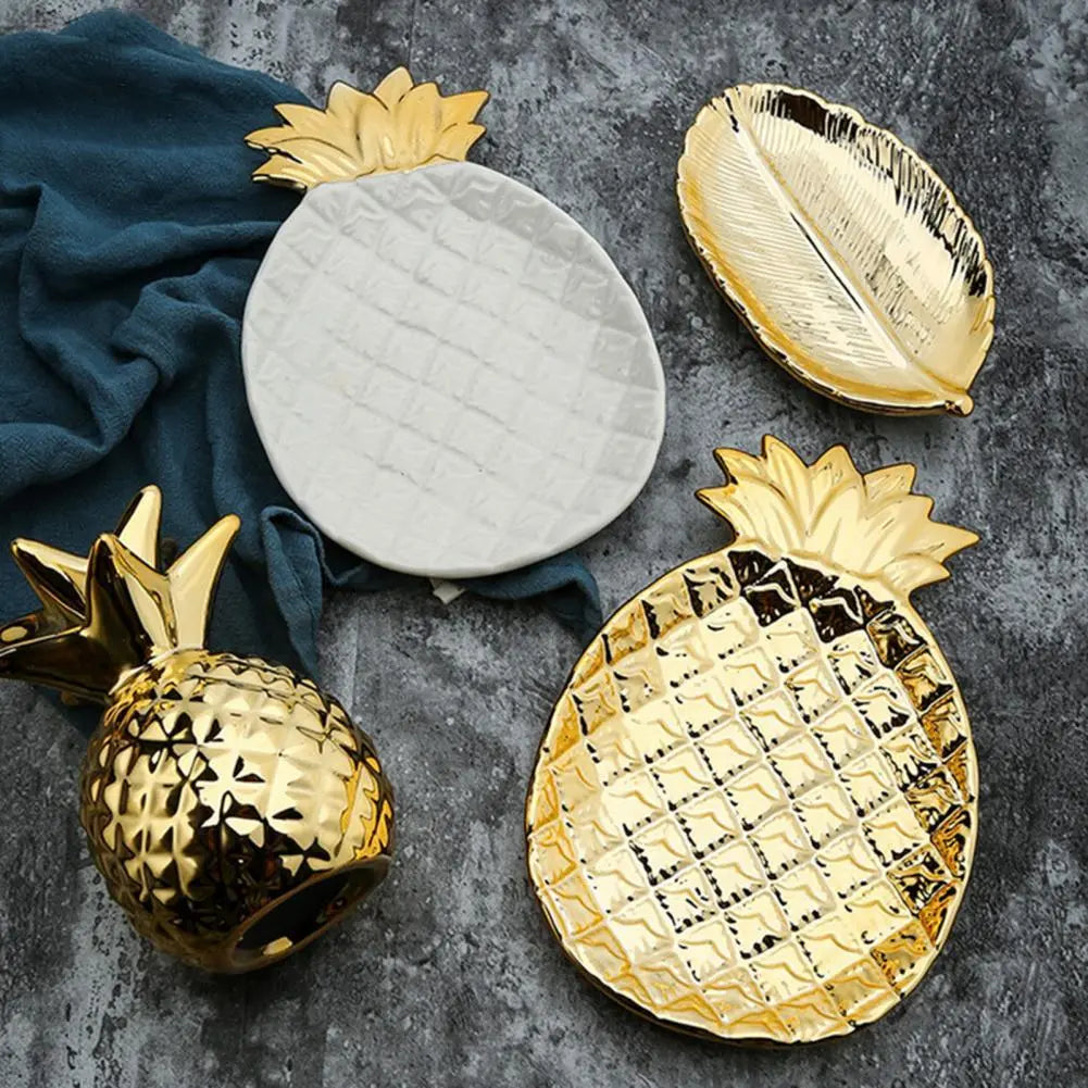 white and gold pineapple dishes