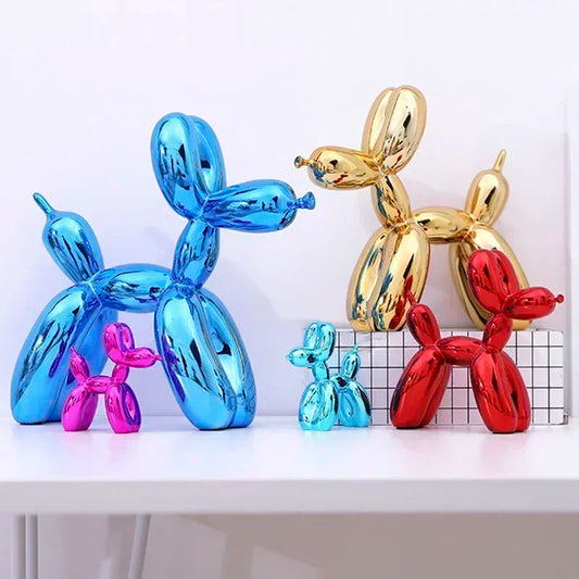 Colorful balloon dog sculptures on a white surface with a light gray background