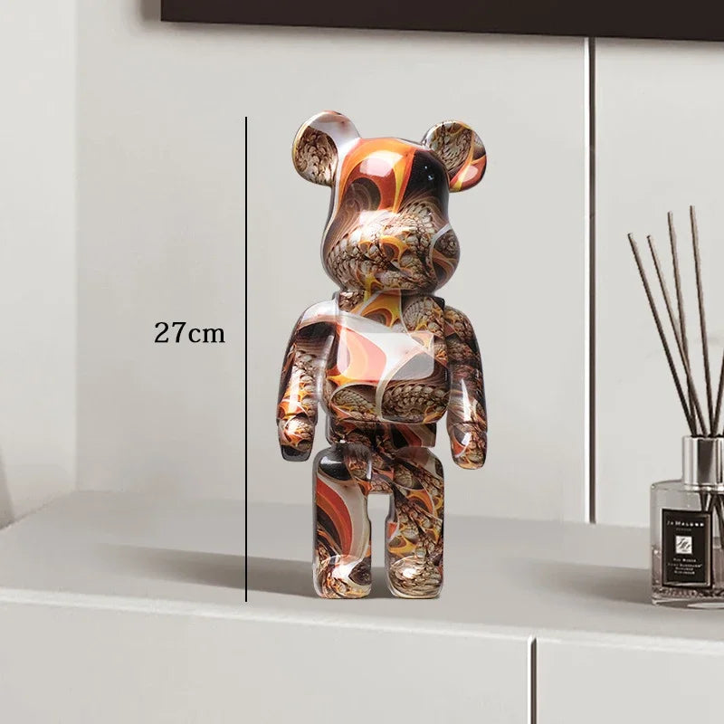 Decorative bear figure with marbled pattern on a white surface next to a diffuser. be@rbrick collectable