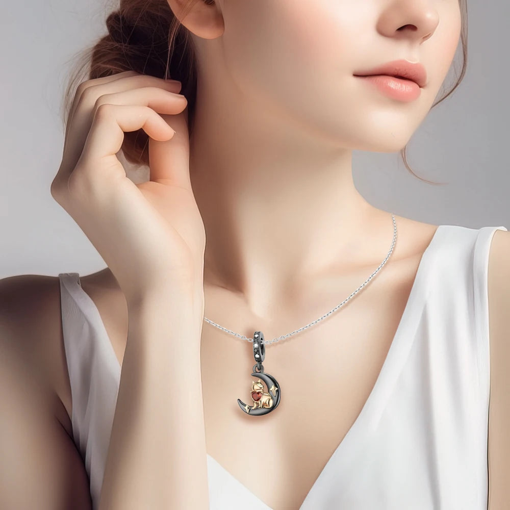 Woman wearing a necklace with a moon-shaped pendant featuring a bear. pandora style charm pendant