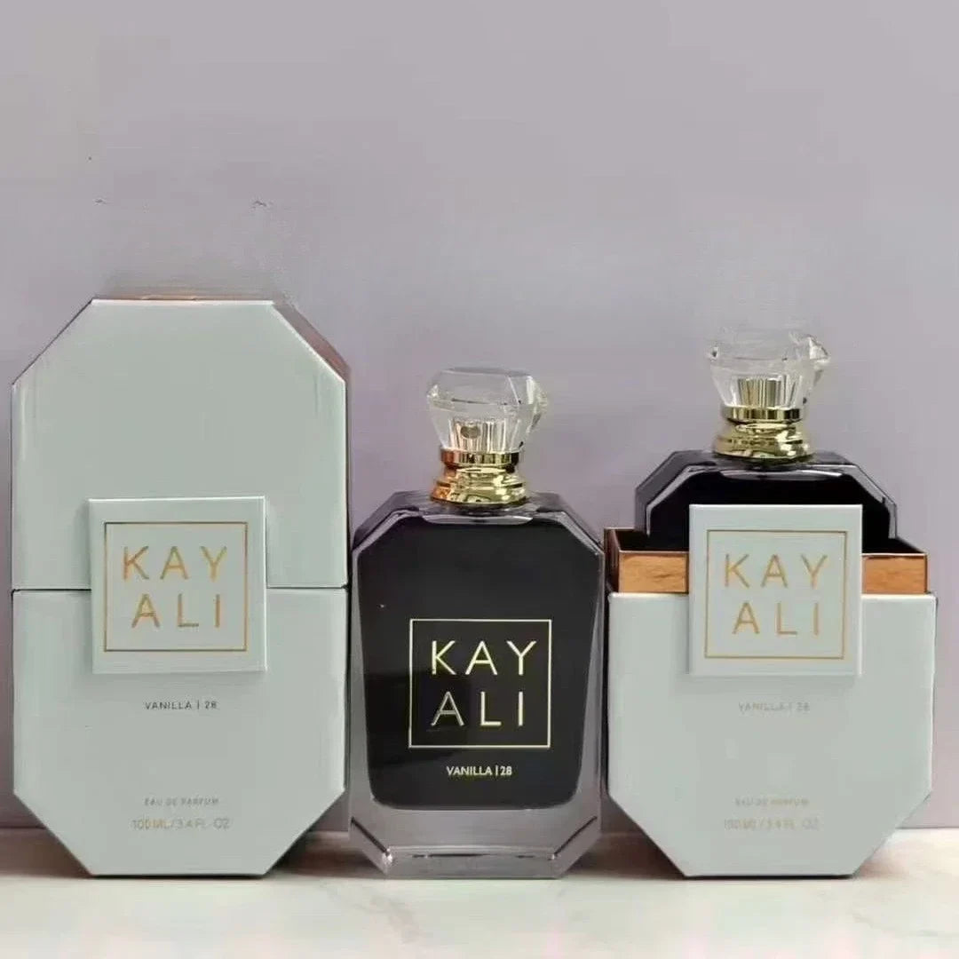 Two black perfume bottles with gold caps and 'KAY ALI' packaging on a light gray background.