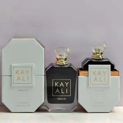 Two black perfume bottles with gold caps and 'KAY ALI' packaging on a light gray background.