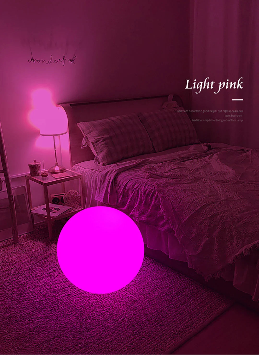 Bedroom with a glowing pink light on the floor, matching the color of the bedding and walls.