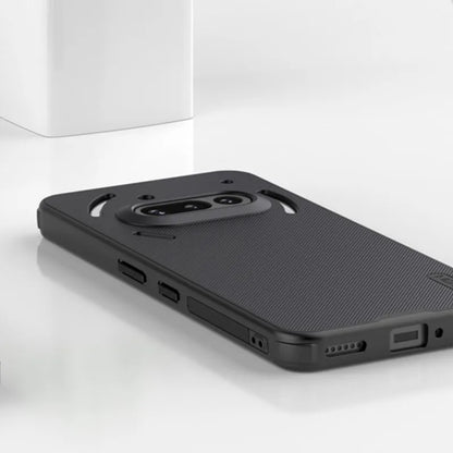 Black phone case on a white surface with a light gray background