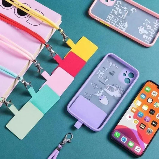 Colorful phone cases with lanyards on a teal background