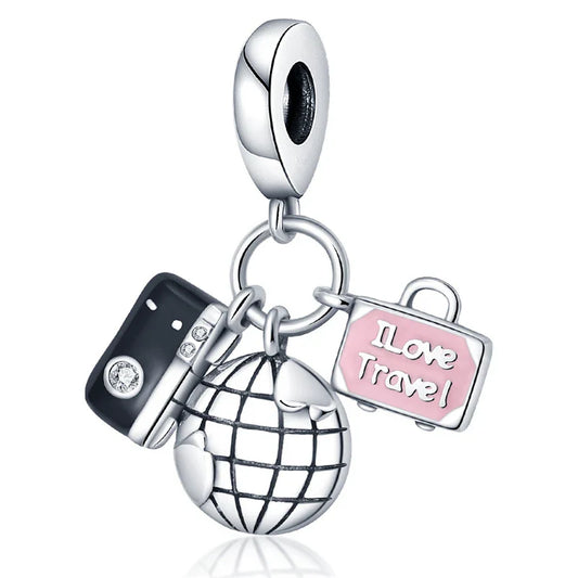 Pendant charm with travel-themed elements on a white background