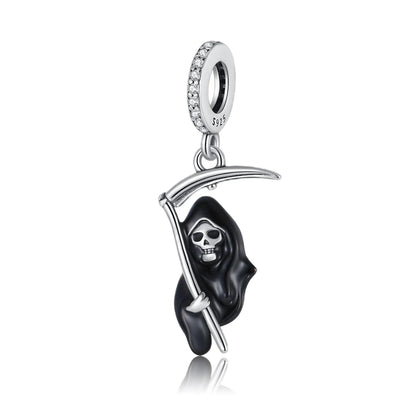 Silver pendant with a black hooded grim reaper skull design on a white background. pandora style charm pendant. Gothic style, halloween theme 