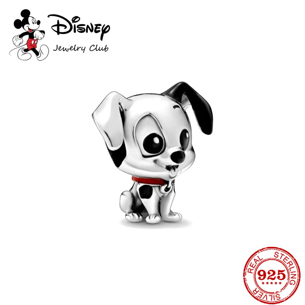 Disney jewelry charm of a black and white dog with a red collar on a white background, featuring the Disney Jewelry Club logo.