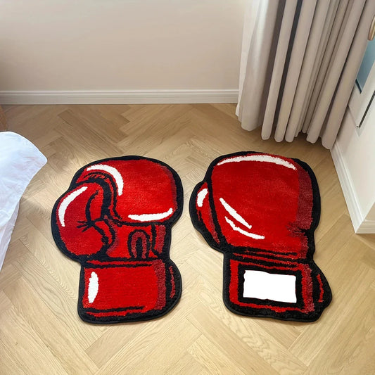 Red boxing glove-shaped mats on a wooden floor.