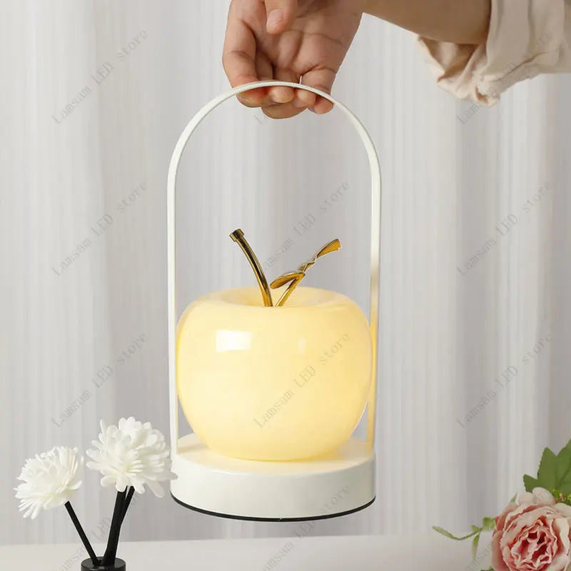 Decorative lamp shaped like an apple with a white background