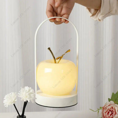 Decorative lamp shaped like an apple with a white background