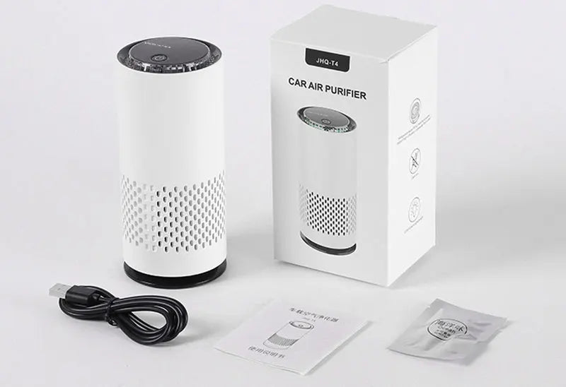 Car air purifier with packaging, power cable, and filter on a white background