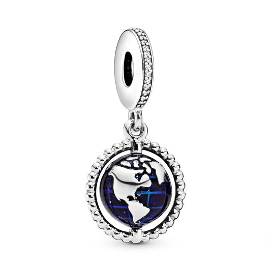 Silver charm with a world map design on a white background