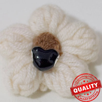 White knitted flower with a black center on a white background, featuring a '925 Sterling Silver' quality guarantee stamp. Black heart. pandora style charm pendant. Gothic style, halloween theme