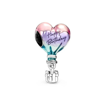 Heart-shaped charm with 'Happy Birthday' text on a white background