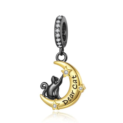 Pendant with a cat on a moon, 'Dear Cat' text, and diamond accents on a white background. pandora style charm pendant. Gothic style, halloween theme