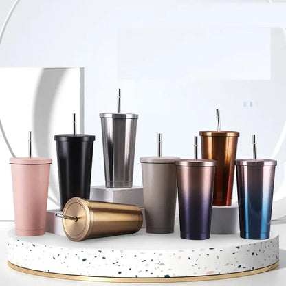 Collection of colorful tumblers with straws on a white surface