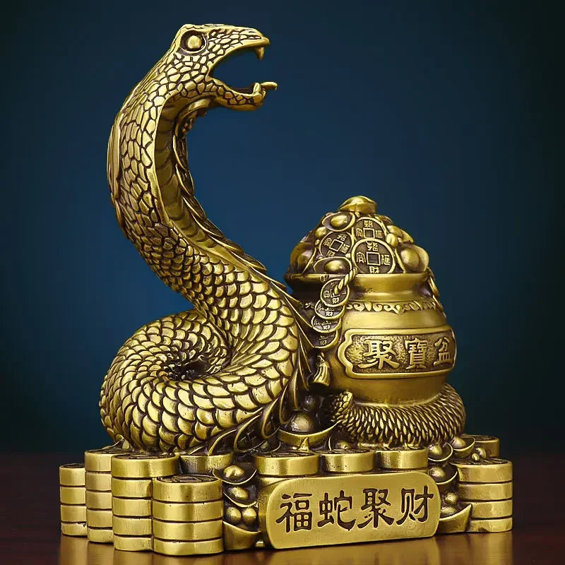 A bronze colored metal ornament in the shape of a snake coiled around a pot with Chinese characters inscribed, representing the Twelve Zodiac Snakes theme.