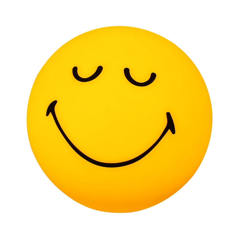 Smiley face with closed eyes on a yellow background