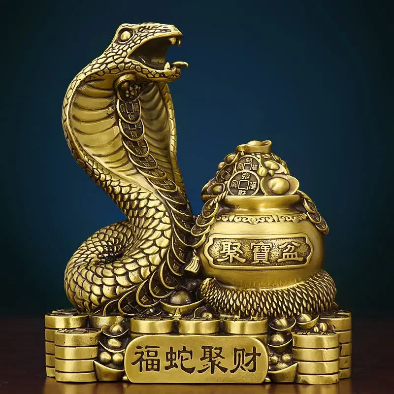 A bronze colored metal ornament in the shape of a snake coiled around a pot with Chinese characters inscribed, representing the Twelve Zodiac Snakes theme.